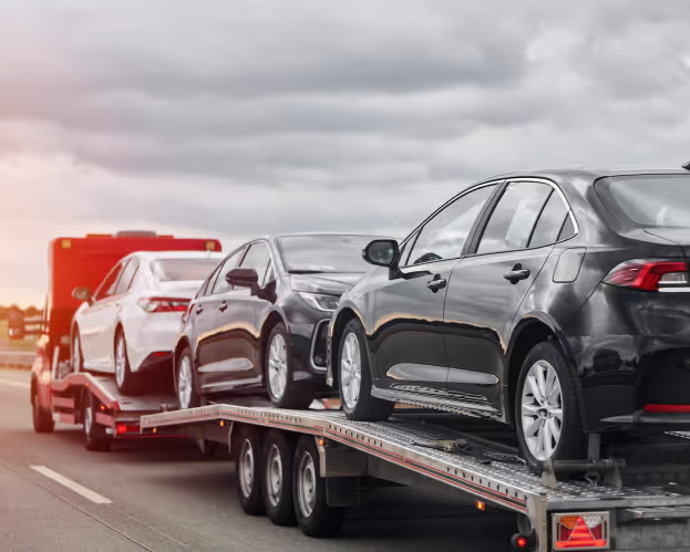 Car being transported on a truck