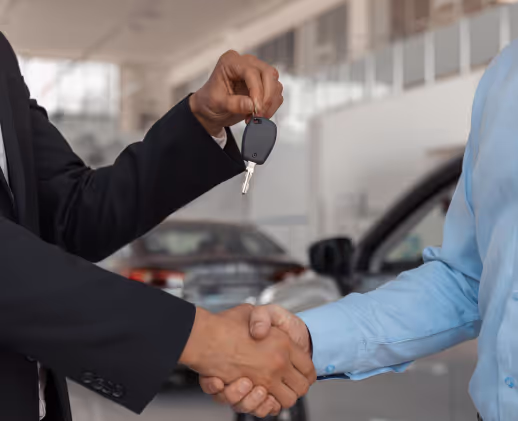 Customer shaking hands after a successful auction